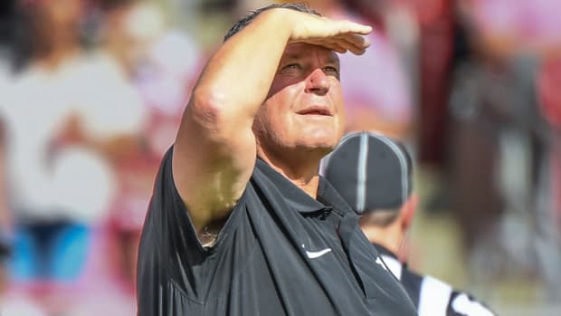 Razorbacks coach Sam Pittman looking at scoreboard against Mississippi State